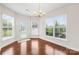 Bright dining area features hardwood floors, natural light from the bay windows, and access to the backyard at 586 Brookhaven Dr, Fort Mill, SC 29708