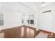 Elegant dining area with wood floors, and ample natural light from large windows, perfect for Gathering gatherings at 586 Brookhaven Dr, Fort Mill, SC 29708
