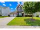 Lovely home with stone and siding facade, a three-car garage, and an inviting, well-maintained front yard at 586 Brookhaven Dr, Fort Mill, SC 29708