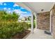 Inviting covered front porch with stone accents offering a pleasant view of the neighborhood at 586 Brookhaven Dr, Fort Mill, SC 29708