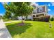 Lush green lawn and mature trees accentuate this charming home's curb appeal in a tranquil neighborhood at 586 Brookhaven Dr, Fort Mill, SC 29708