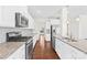 Modern kitchen with stainless steel appliances, granite countertops, and ample cabinet space at 586 Brookhaven Dr, Fort Mill, SC 29708
