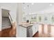 Kitchen island featuring granite countertops, stainless steel dishwasher, and open layout to living area at 586 Brookhaven Dr, Fort Mill, SC 29708