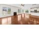 Bright living room features a fireplace, hardwood floors, and plenty of natural light at 586 Brookhaven Dr, Fort Mill, SC 29708