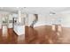 Open-concept living room with hardwood floors, stainless steel appliances, and stairway at 586 Brookhaven Dr, Fort Mill, SC 29708