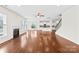 Inviting living room with hardwood floors, a fireplace, and an open layout that flows into the kitchen at 586 Brookhaven Dr, Fort Mill, SC 29708