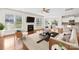 Bright living room features a fireplace, ceiling fan, hardwood floors, and plenty of natural light at 586 Brookhaven Dr, Fort Mill, SC 29708