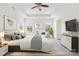 This is a spacious main bedroom with a ceiling fan, windows, and carpeted floor at 586 Brookhaven Dr, Fort Mill, SC 29708