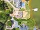 Aerial view showing house, manicured lawn, boat dock, and community swimming pool at 5985 Natoma Rd, Clover, SC 29710