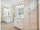 Elegant bathroom featuring dual vanities, LED mirrors, and ample cabinet space at 5985 Natoma Rd, Clover, SC 29710