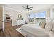 Bright bedroom featuring wood floors, white furnishings, and a waterfront view at 5985 Natoma Rd, Clover, SC 29710