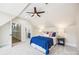 Bright bedroom with ceiling fan, carpet, and a private en suite bathroom at 5985 Natoma Rd, Clover, SC 29710