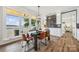 Dining room with large windows overlooking the lake and a built-in wet bar perfect for entertaining at 5985 Natoma Rd, Clover, SC 29710