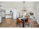 Open-concept layout showcases dining area, kitchen and living room with natural light at 5985 Natoma Rd, Clover, SC 29710