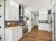 Modern kitchen featuring white cabinetry, stainless steel appliances and backsplash at 5985 Natoma Rd, Clover, SC 29710
