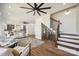 Spacious living room with modern decor, fireplace and staircase; open floor plan concept at 5985 Natoma Rd, Clover, SC 29710