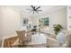 Bright office space with a ceiling fan, warm paint, wood floors, and natural light at 5985 Natoma Rd, Clover, SC 29710