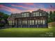 Home's outdoor space provides views for both relaxing and entertaining; manicured lawn at 5985 Natoma Rd, Clover, SC 29710