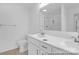 Bright bathroom features a double vanity with sleek fixtures and a glass-enclosed shower at 614 Wabash Ave # 9, Charlotte, NC 28208