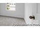 Bedroom with soft carpet flooring, bright window view and door with knob at 614 Wabash Ave # 9, Charlotte, NC 28208
