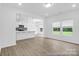 Spacious living area with a stylish kitchen, showcasing ample natural light and an open floor plan at 614 Wabash Ave # 9, Charlotte, NC 28208