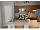 Kitchen with island seating and stainless steel appliances at 6148 Meadow Rose Ln, Charlotte, NC 28215