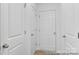 Hallway with doors leading to various rooms at 650 Wabash Ave # 1, Charlotte, NC 28208