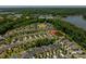 Stunning aerial view shows the neighborhood's layout near green spaces, pond, and a beautiful lake at 658 Gardenbrook Trl, Belmont, NC 28012