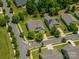 Aerial view of the home and neighborhood showcases well-maintained streets, mature trees and beautiful landscaping at 658 Gardenbrook Trl, Belmont, NC 28012