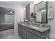 Double vanities with granite countertops highlight the bathroom at 658 Gardenbrook Trl, Belmont, NC 28012