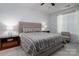 Bedroom with ceiling fan features carpet, neutral walls, and a bed at 658 Gardenbrook Trl, Belmont, NC 28012