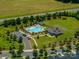 Aerial view of the community pool, clubhouse, and surrounding green space provides a resort-like atmosphere at 658 Gardenbrook Trl, Belmont, NC 28012