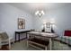 Cozy dining area featuring wood floors, stylish lighting, and comfortable seating at 658 Gardenbrook Trl, Belmont, NC 28012