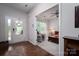 Inviting entryway with hardwood floors, a glass-paneled door, and a glimpse into a cozy living room at 658 Gardenbrook Trl, Belmont, NC 28012