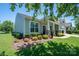 Charming home featuring a covered porch, well-kept lawn, and lush landscaping, perfect for enjoying the outdoors at 658 Gardenbrook Trl, Belmont, NC 28012
