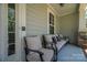 Cozy front porch featuring comfortable seating, neutral colors, and ample space for relaxation and outdoor enjoyment at 658 Gardenbrook Trl, Belmont, NC 28012