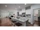 Open kitchen showcasing a large island, stainless steel appliances, and modern finishes at 658 Gardenbrook Trl, Belmont, NC 28012