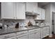 Well-equipped kitchen with granite countertops, modern backsplash, and stainless steel range at 658 Gardenbrook Trl, Belmont, NC 28012