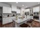 Spacious kitchen featuring granite countertops, white cabinets, and stainless steel appliances at 658 Gardenbrook Trl, Belmont, NC 28012