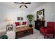 Inviting living room featuring a fireplace, comfortable seating, and a ceiling fan at 658 Gardenbrook Trl, Belmont, NC 28012