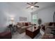 Comfortable living room with neutral tones, a large sofa, a coffee table, and natural light from the window at 658 Gardenbrook Trl, Belmont, NC 28012