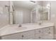 Bathroom with a double sink vanity, large mirror and lots of lighting at 6603 Brenock Ln, Charlotte, NC 28269