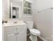 Traditional bathroom with a single vanity, mirror, and toilet at 6603 Brenock Ln, Charlotte, NC 28269