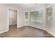 Bright and open bedroom with neutral walls, large windows, and new floors with easy access to the ensuite bathroom at 6603 Brenock Ln, Charlotte, NC 28269