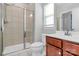Modern bathroom featuring a glass-enclosed shower, stylish vanity, and tiled floors at 7079 Waterwheel Sw St, Concord, NC 28025