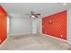 Bedroom featuring a ceiling fan and bright accent wall at 7079 Waterwheel Sw St, Concord, NC 28025