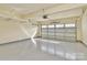 Clean, spacious garage with concrete flooring and a modern door at 7079 Waterwheel Sw St, Concord, NC 28025
