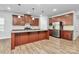 Modern kitchen featuring a large island, stainless steel appliances, and sleek cabinetry at 7079 Waterwheel Sw St, Concord, NC 28025