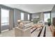 Stylish living room featuring comfortable seating, modern decor, and abundant natural light at 7079 Waterwheel Sw St, Concord, NC 28025