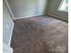 Bedroom with neutral carpet and light gray walls at 7315 Fig Ln, Charlotte, NC 28215